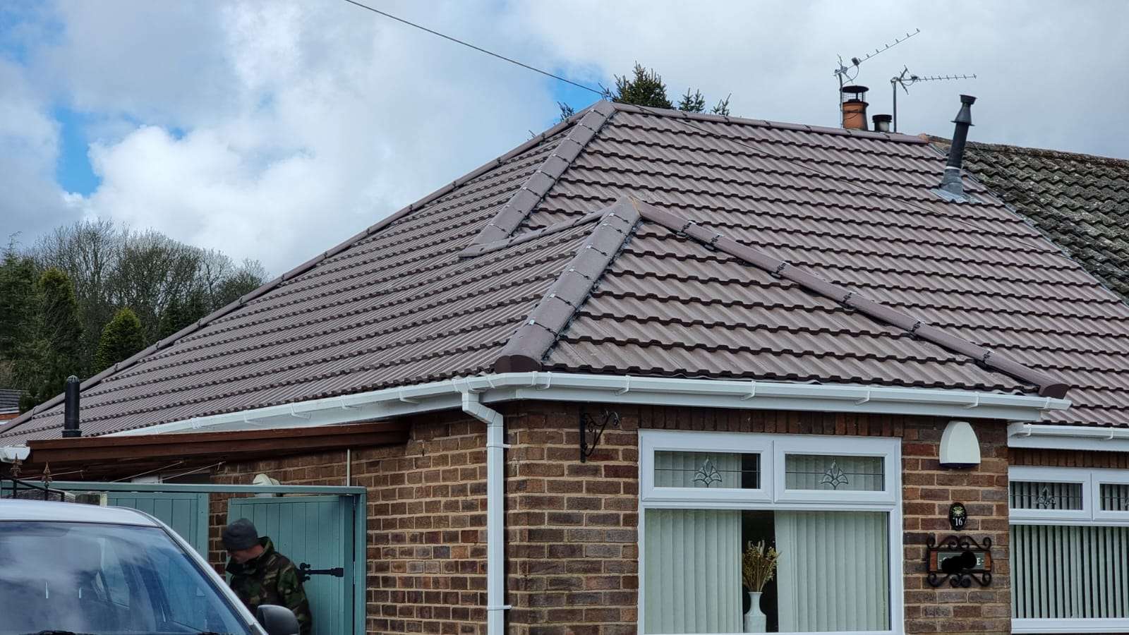 Completed tiled roof and white roofline on a home near St Helens by TRS