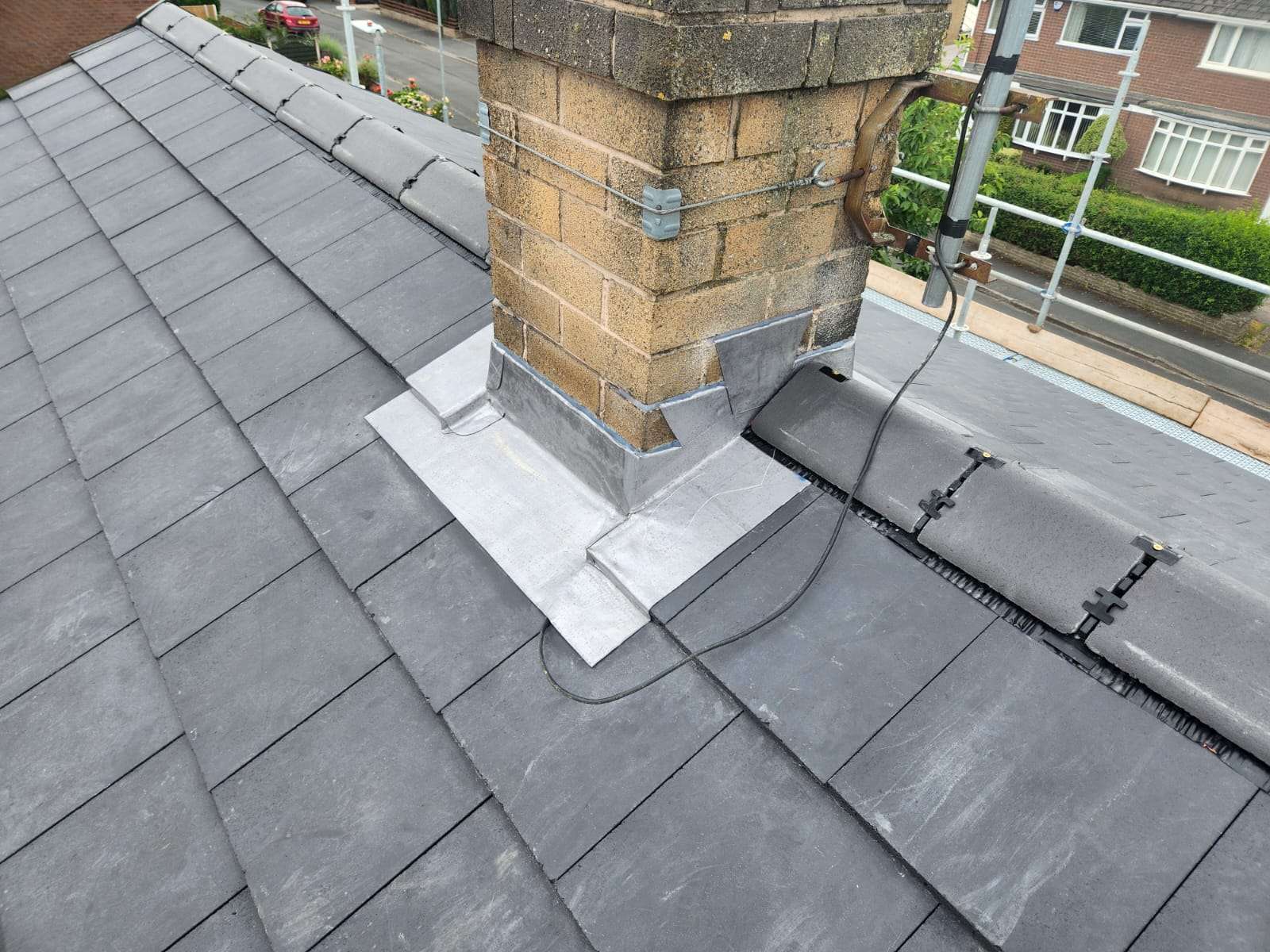 Lead flashing repair around a chimney on a slate roof in Preston