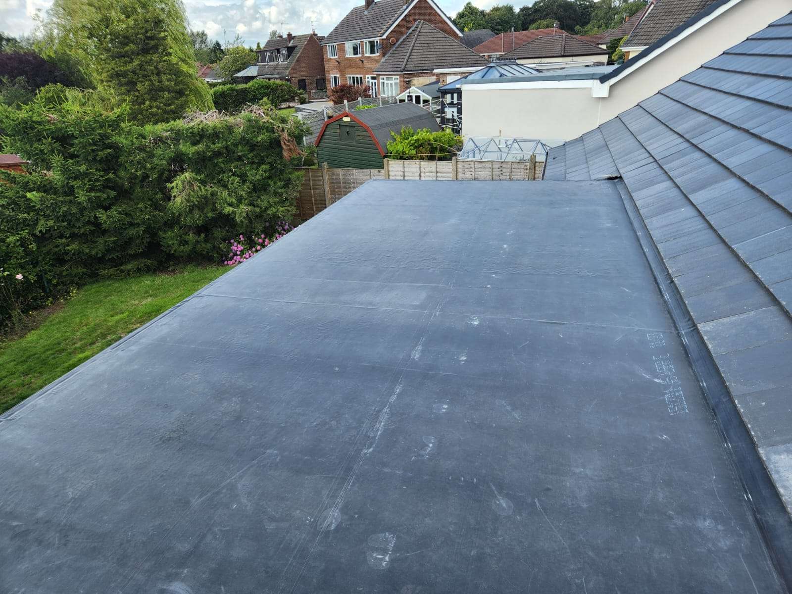 Replacement roof on a 1970s house in Warrington with new tiles and dry ridge