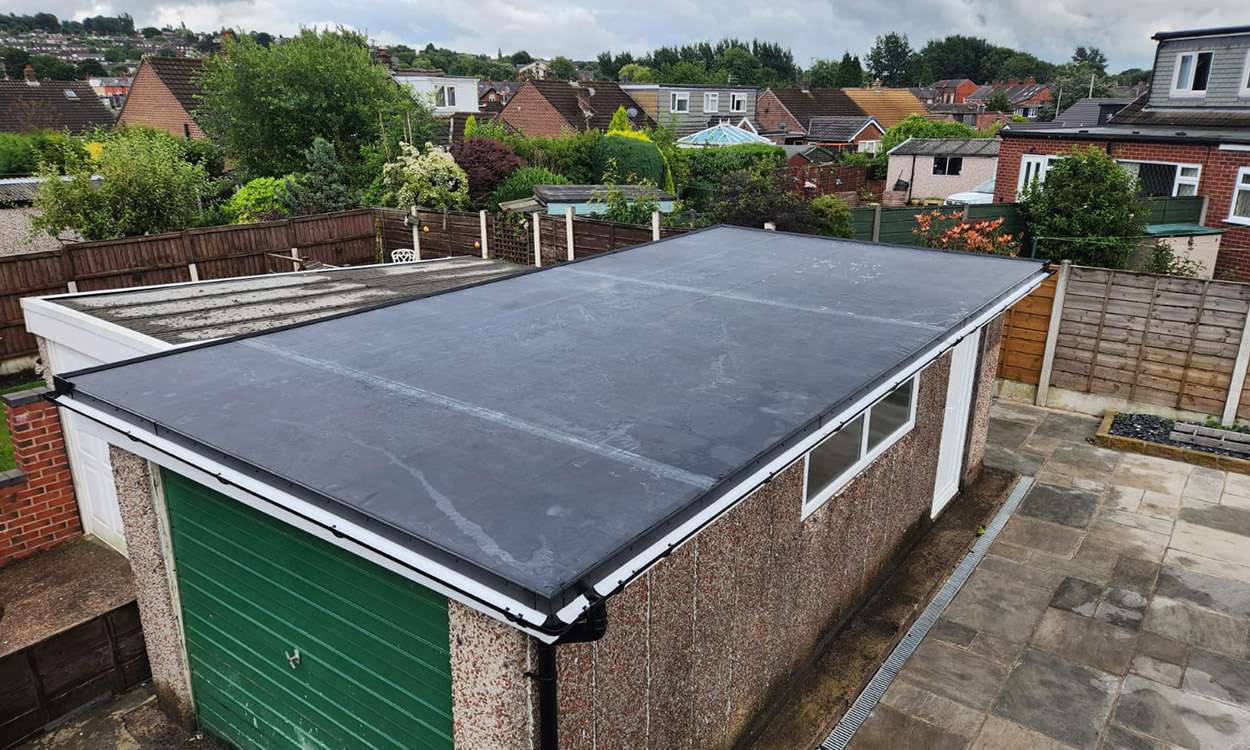 New EPDM flat roof fitted to a garage in Bolton by TRS Roofing and Guttering